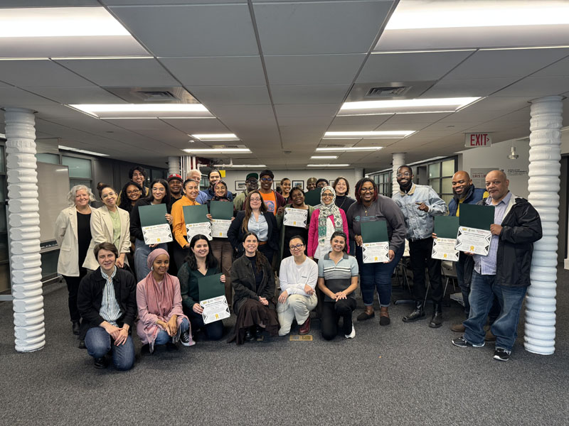 o	This image shows a group of CEC staff and implementing partners posing for a group photo after the implementing partners received certificates for completing the Capacity Building Workshops