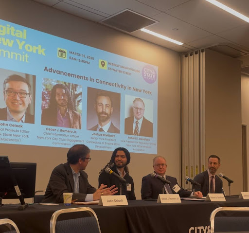 4 Panelists - including Oscar Romero (Chief Information Officer at NYCCEC), Joshua Breitbart (Senior Vice President ConectALL of Empire State Development), Robert D. Gaudioso (Vice President of Regulatory Affairs New York State Wireless Association), moderated by John Celock (Special Projects Editor, City & State New York) - pictured at the Digital New York Summit for a panel titled 'Advancements in Connectivity in New York'