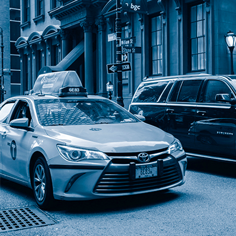 Blue filtered photo of an NYC taxicab