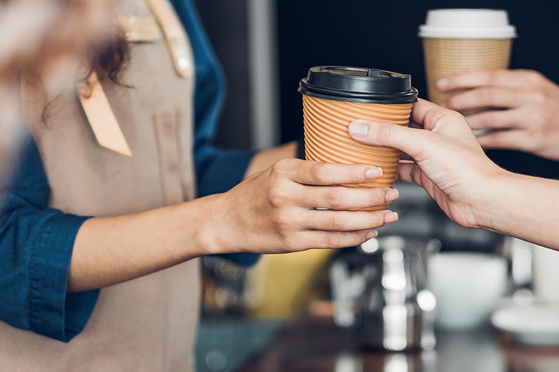 Barista giving coffee to customer
                                           