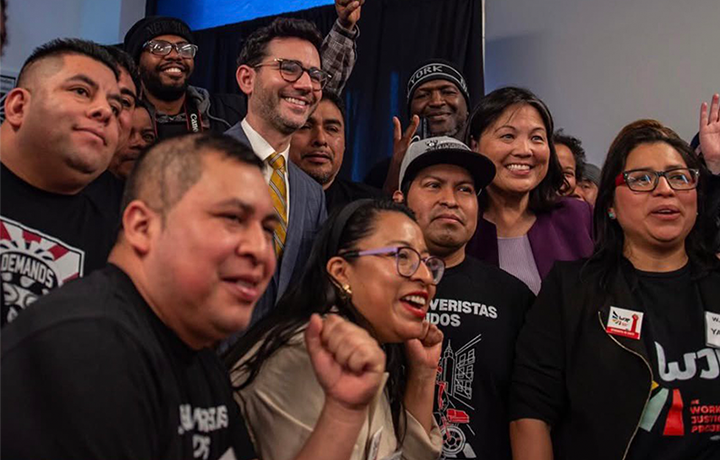 Commissioner Levine poses with Julie Su and members of Workers Justice Project and Los Deliveristas
                                           