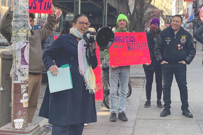 Commissioner Mayuga at rally with workers to support Austin's return to work.
                                           