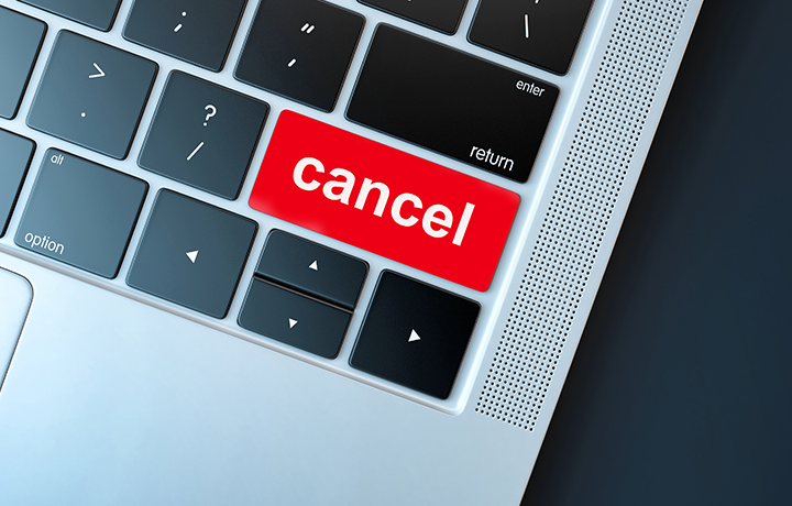 Laptop keyboard with red button showing the word 