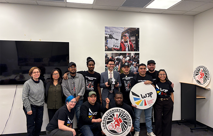 Commissioner Levine poses with members of Workers Justice Project and Los Deliveristas
                                           