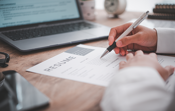 Job seeker looks over resume
                                           