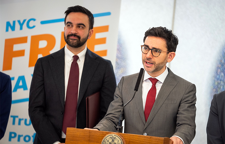 DCWP Commissioner Levine stands at podium with Mayor Mamdani
                                           
