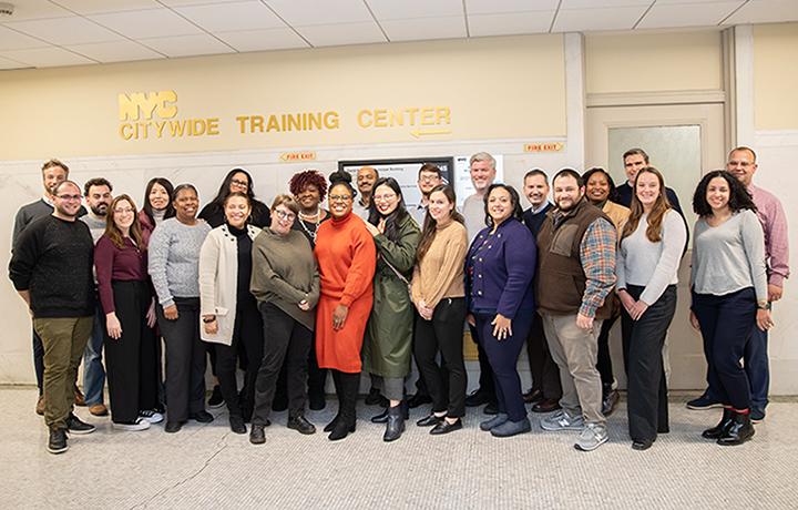 A diverse group of participants in the 2024 Management Academy - cohort 2 in front of the NYC Citywide Training Center offices