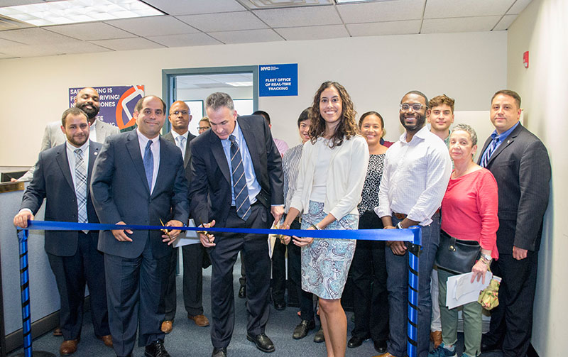 Commissioner Camilo and others cutting the Concessions ribbon