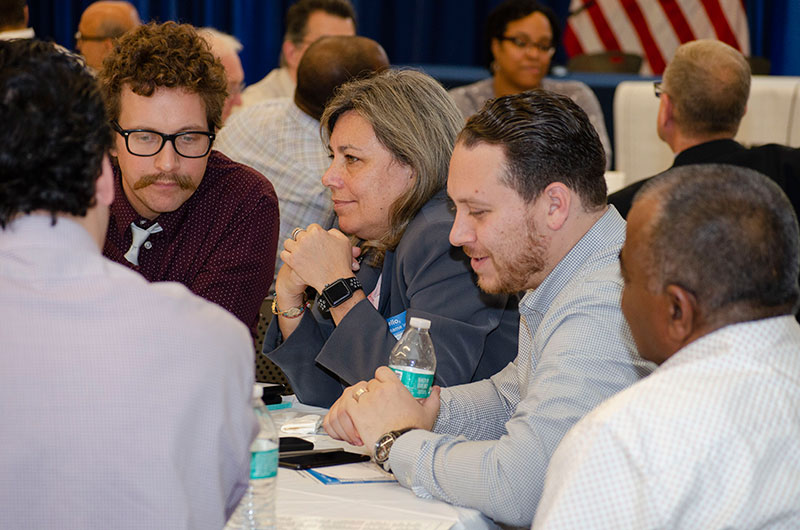 People sitting around a desk