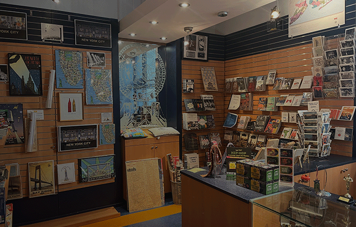 Interior walls of the CityStore with books and other merchandise for sale.
                                           