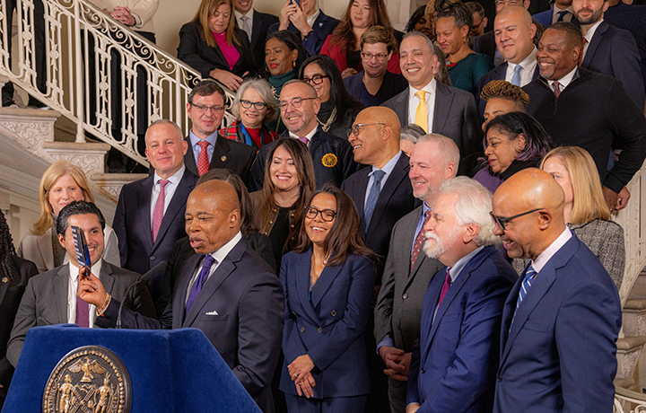 Commissioner Molina joins Mayor Adams and other senior administration officials on the stairs at City Hall.
                                           