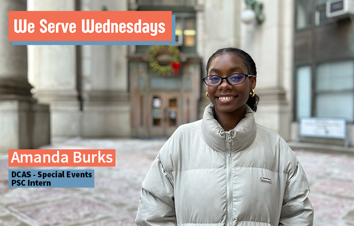 Smiling young woman with glasses wearing a puffy coat standing outside in the One Centre St. plaza.
                                           