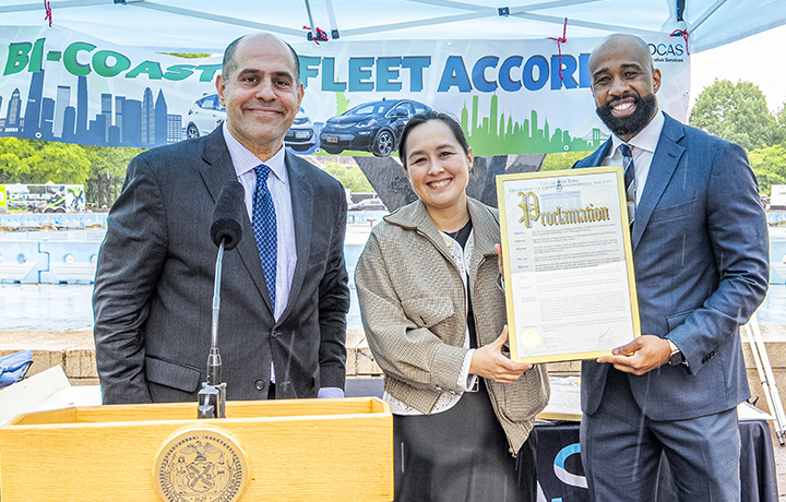 DCAS D/C Keith Kerman, DCAS Commissioner Kitasei, and L A County ISD Chief Deputy Director Quintin Haynes holding proclamation.
                                           