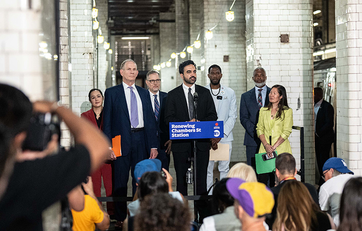 Mayor Zohran Mamdani and DCAS Commissioner Yume Kitasei, are joined by other city officials at an underground subway station for a press announcement.
                                           