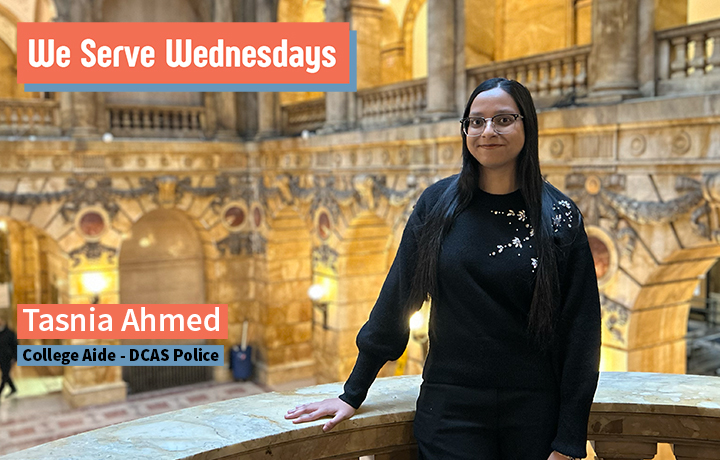 Young woman wearing glasses and a black outfit standing on an upper level inside 31 Chambers St.
                                           