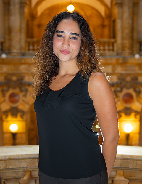 Person smiling, wearing a black shirt.