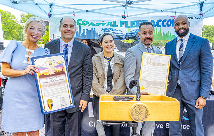 NYC DCAS and LA County officials pose at signing of bicoastal fleet accord.
                                           