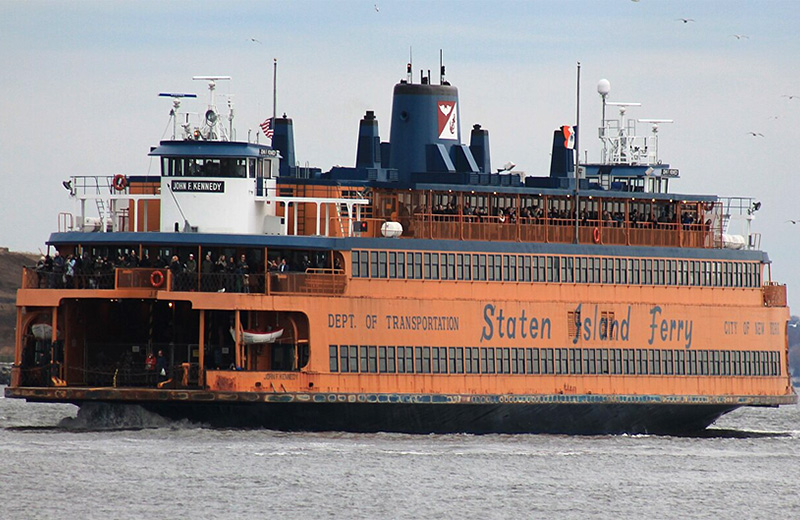A passenger and vehicle Staten Island Ferry in transit.