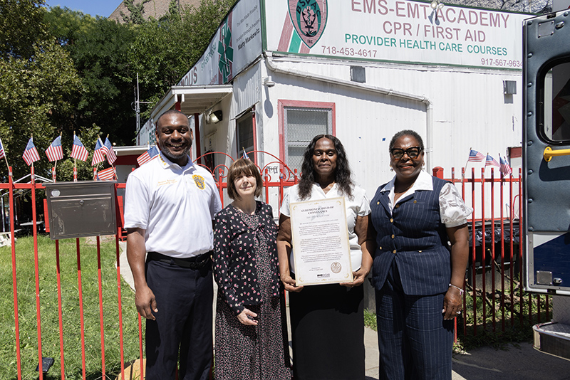 BSVAC President Antoine Robinson, BSVAC Vice President and Treasurer Tamsin Wolf, BSVAC Secretary Vernice Robinson, and New York State Assemblymember Stefani Zinerman pose with DCAS-presented ceremonial deed commemorating the conveyance.