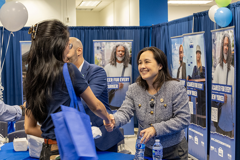 DCAS Commissioner Yume Kitasei greets attendees at the new Jobs NYC Center at 2 Lafayette Street