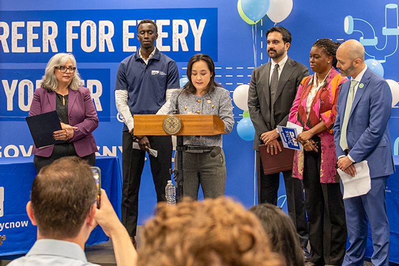 Council Member Shirley Aldebol, NYC BEST member Mohammad Djouf, DCAS Commissioner Yume Kitasei, Mayor Zohran Mamdani, Council Member Shanel Thomas-Henry, and SBS Commissioner Kenny Minaya announce new jobs center