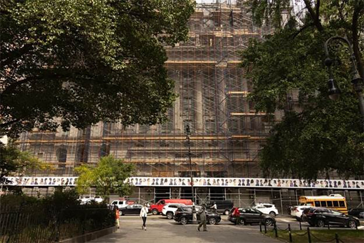 Artwork from Bayeté Ross Smith’s Mirrors series displayed on the sidewalk shed surrounding the Surrogate’s Courthouse at 31 Chambers Street.