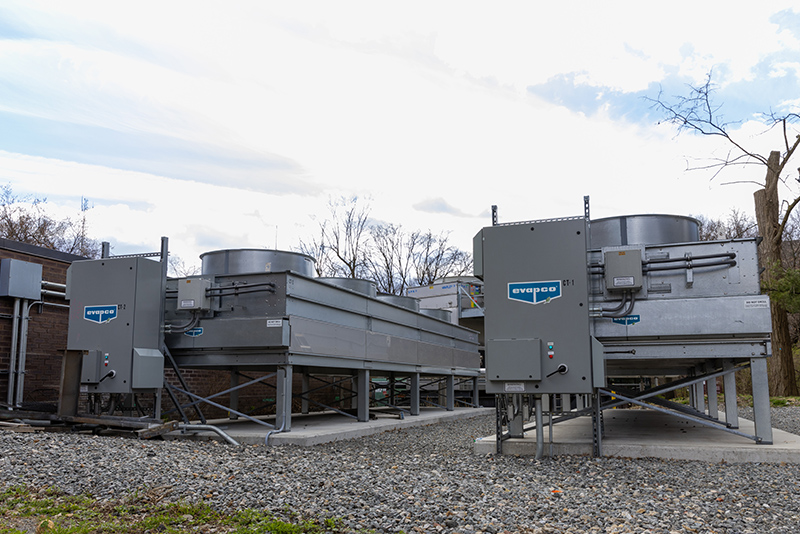 Newly installed cogeneration plant machinery at the Bronx zoo, sitting on a bed of gravel.