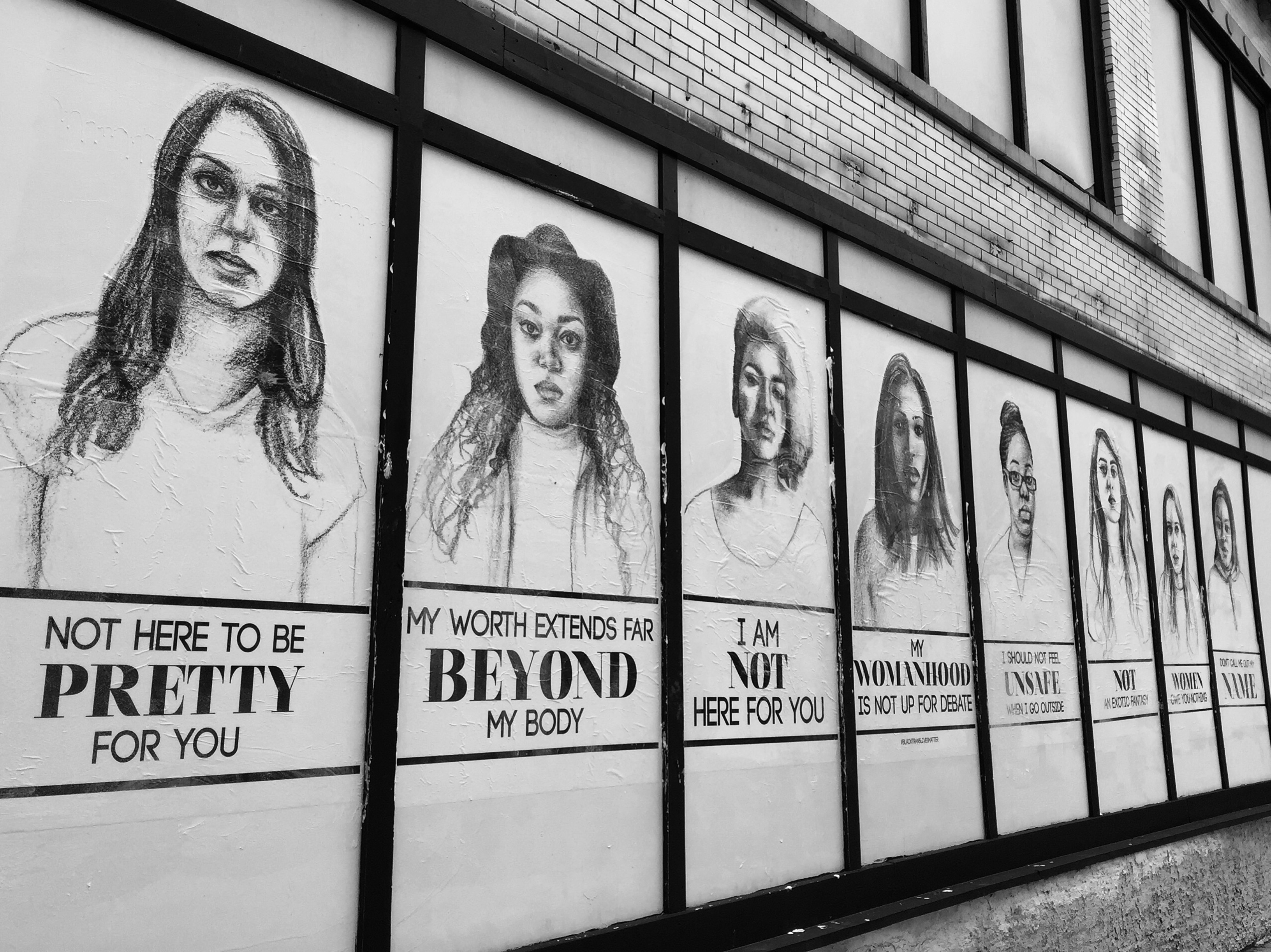 Windows covered with drawings of women