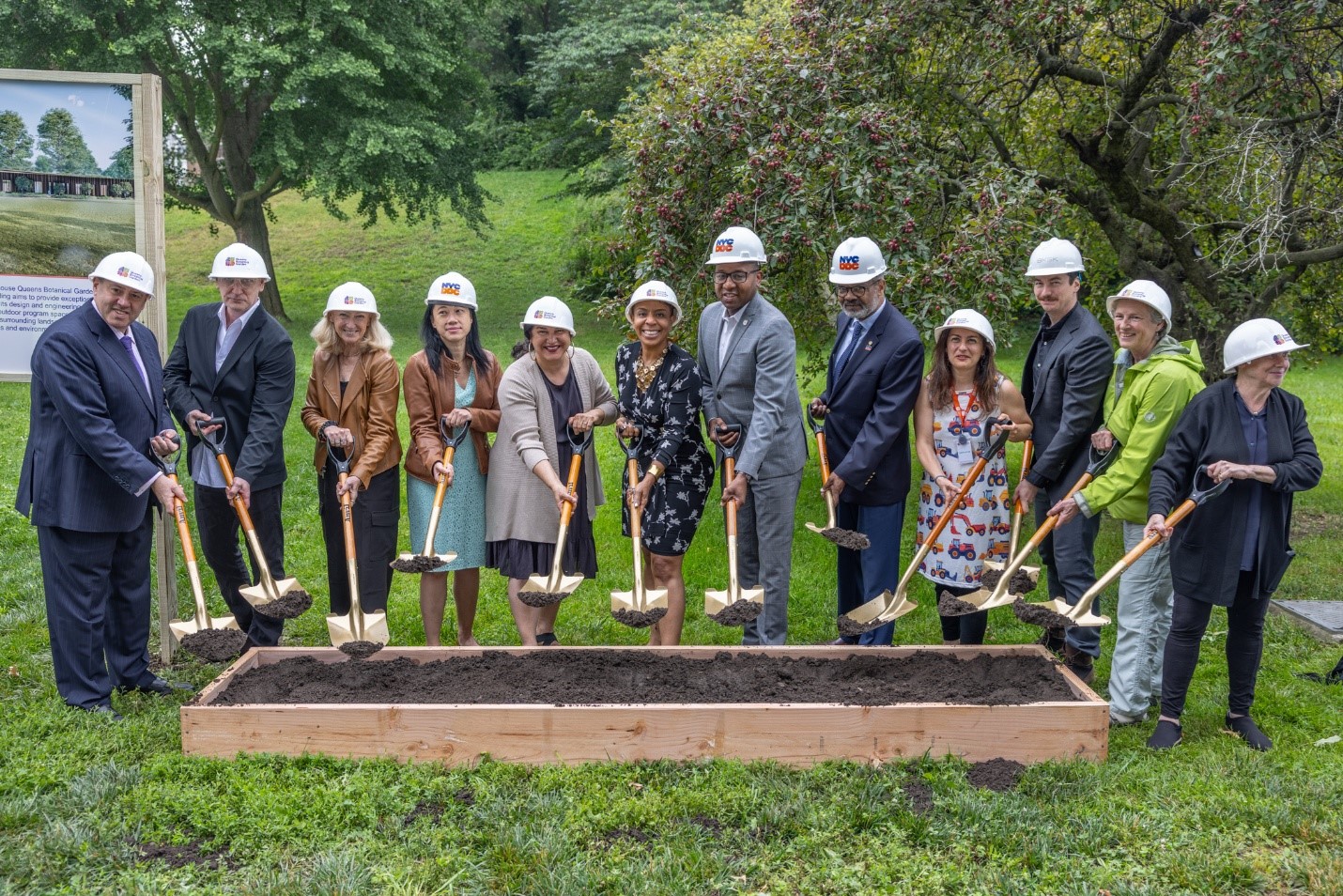 DCLA, DDC, QBG, and partners gather with dirt shovels for the groundbreaking. 