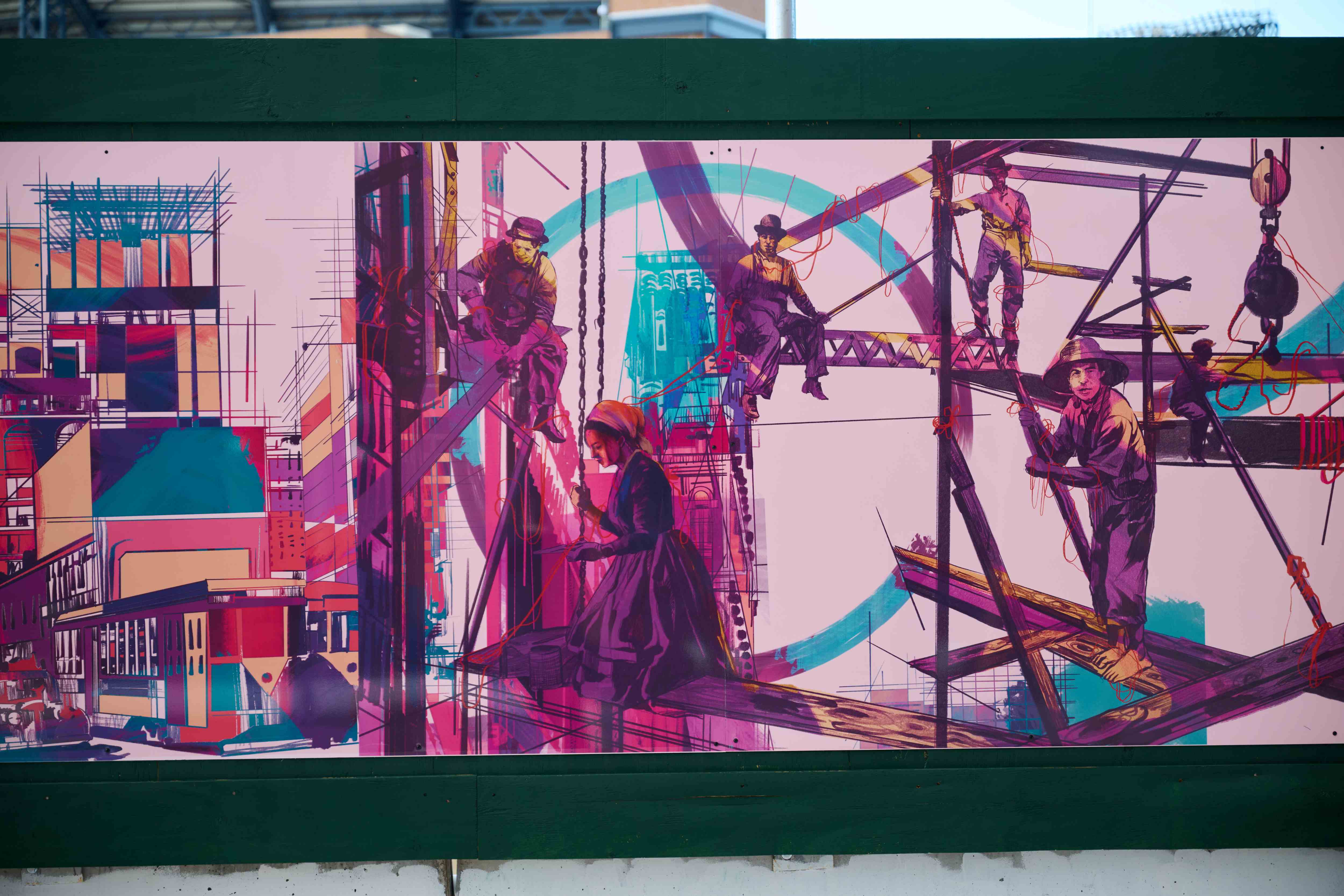 A closeup of the artwork with immigrant workers on beams building skyscrapers.