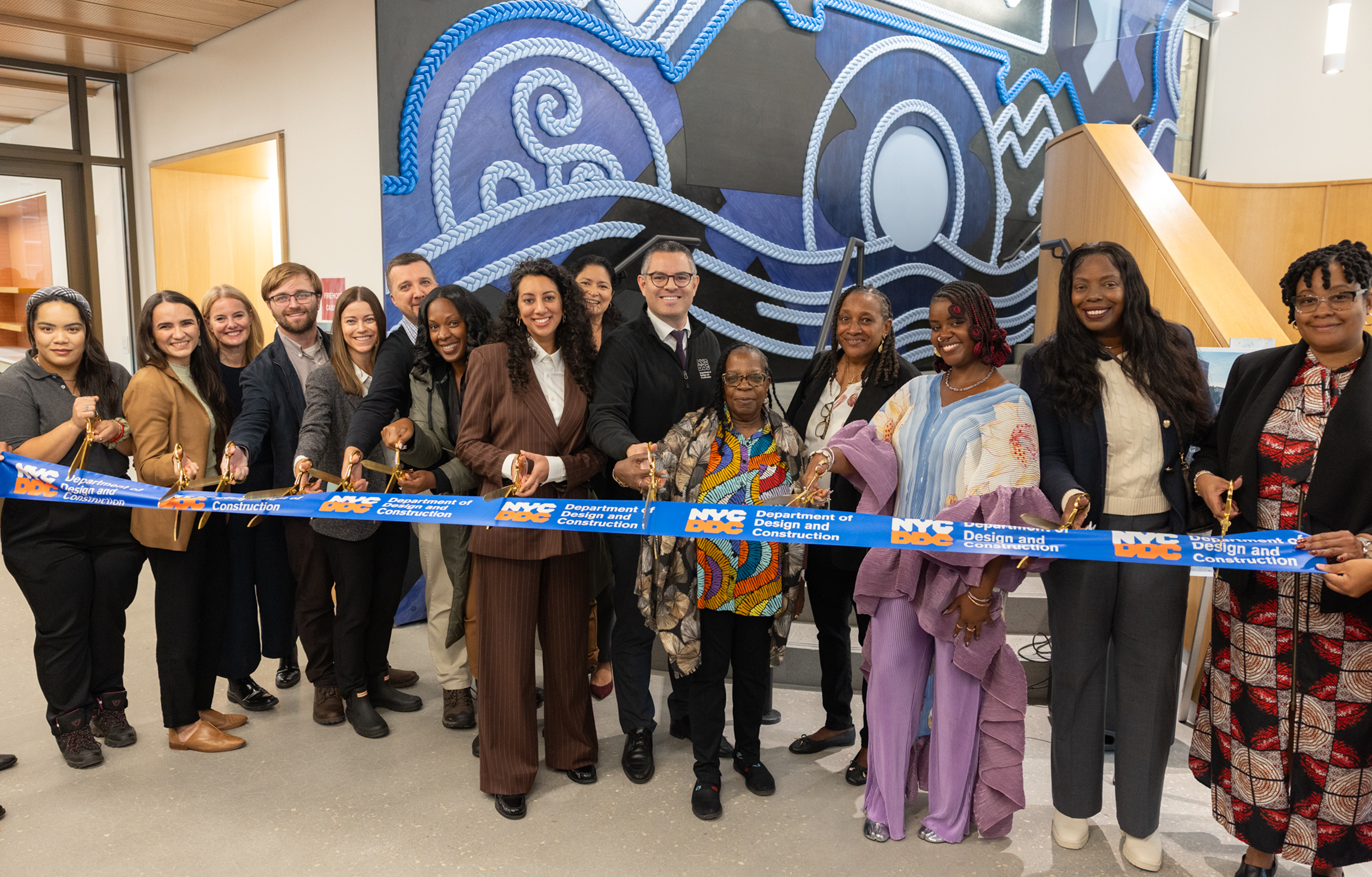 Ribbon cutting event featuring city officials as well as community members
                                           