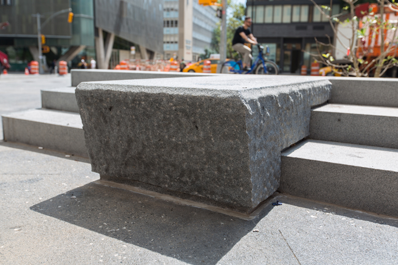New step features in Cooper Triangle provide seating for pedestrians.