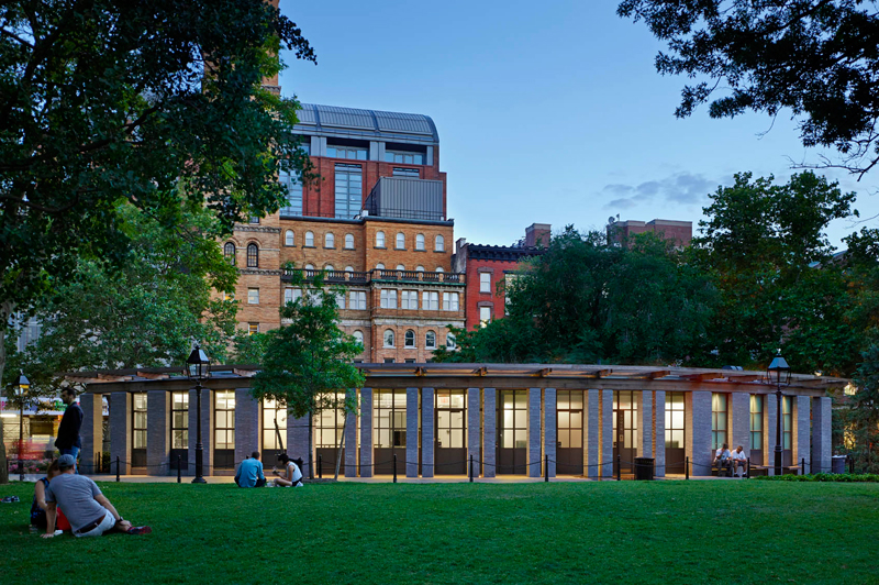 A view of the Washington Square Comfort Station at night.