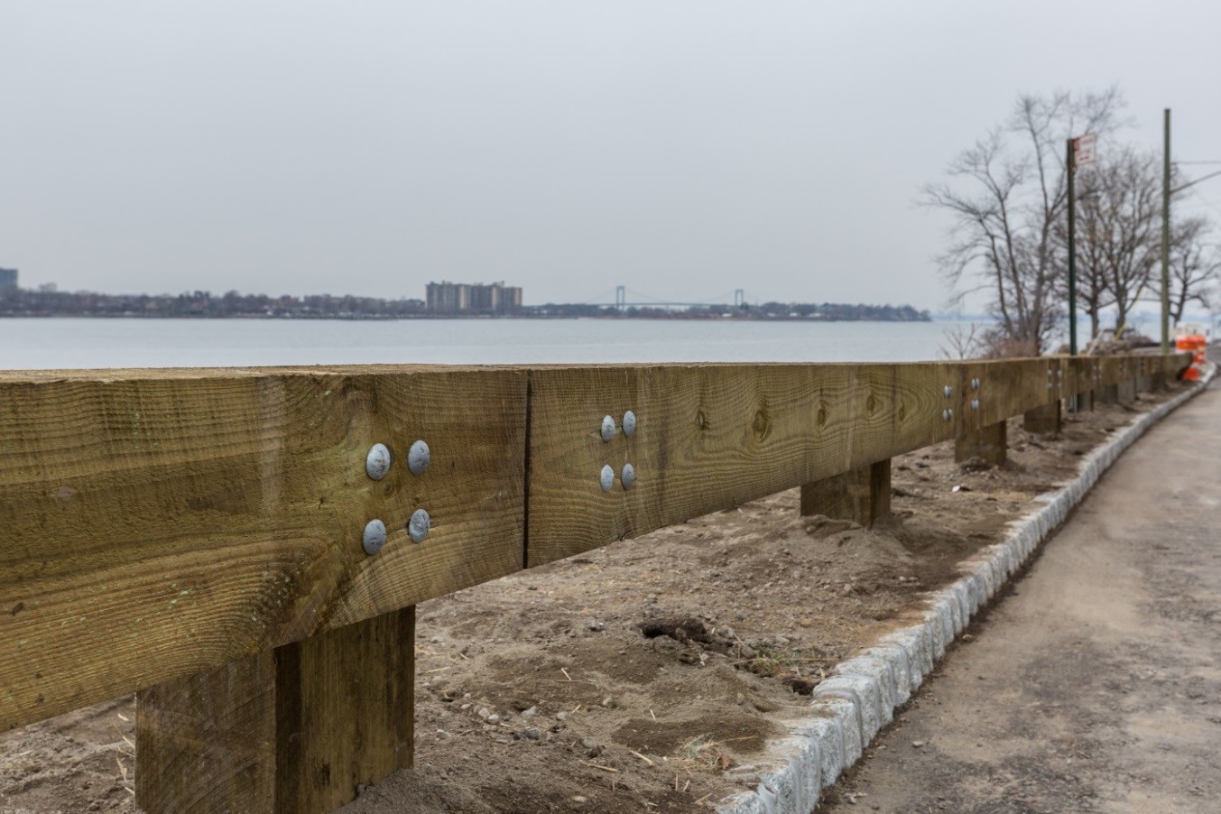 A new steel-backed timber guardrail along Shore Road 