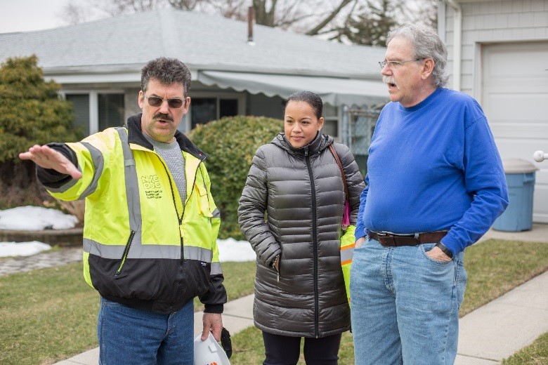 project staff talking with resident