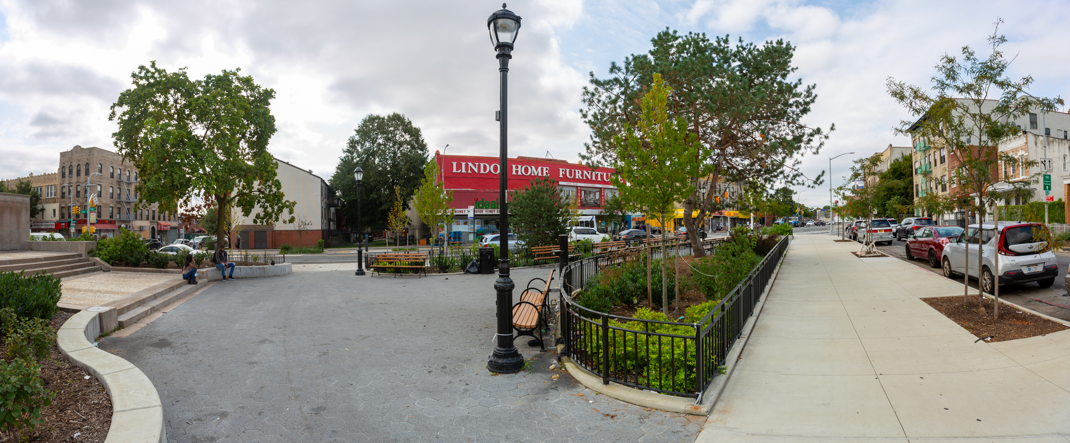 The view near the restored monument shows new paving, lighting and sidewalks