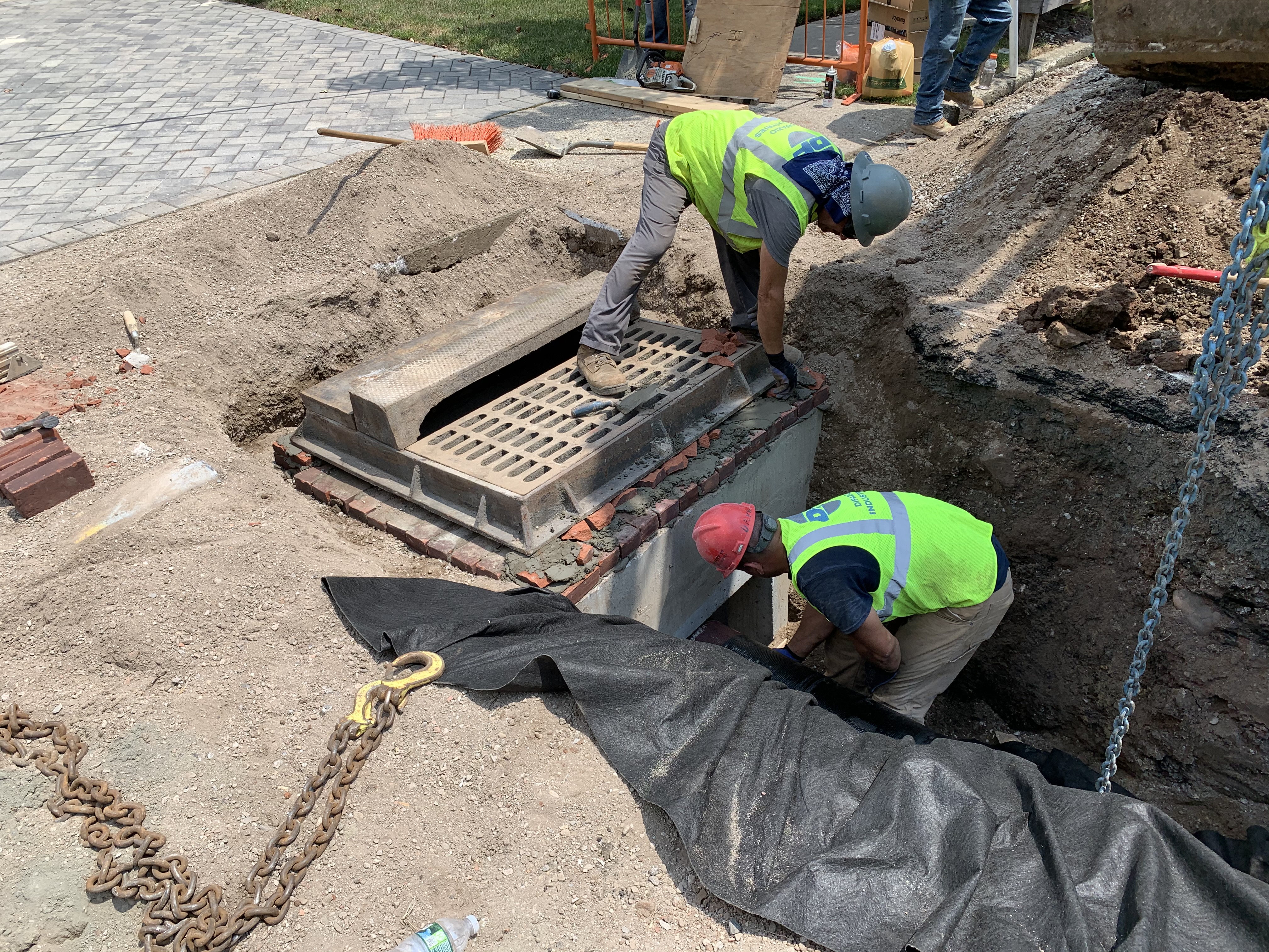 two construction workers working on an infrastructure site