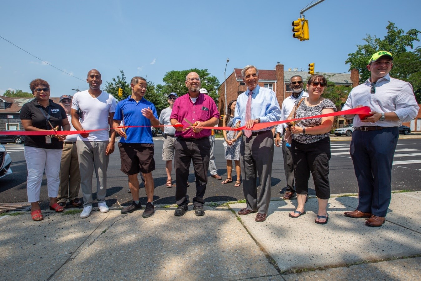 City officials, elected officials, and local civic leaders celebrate with a ribbon cutting