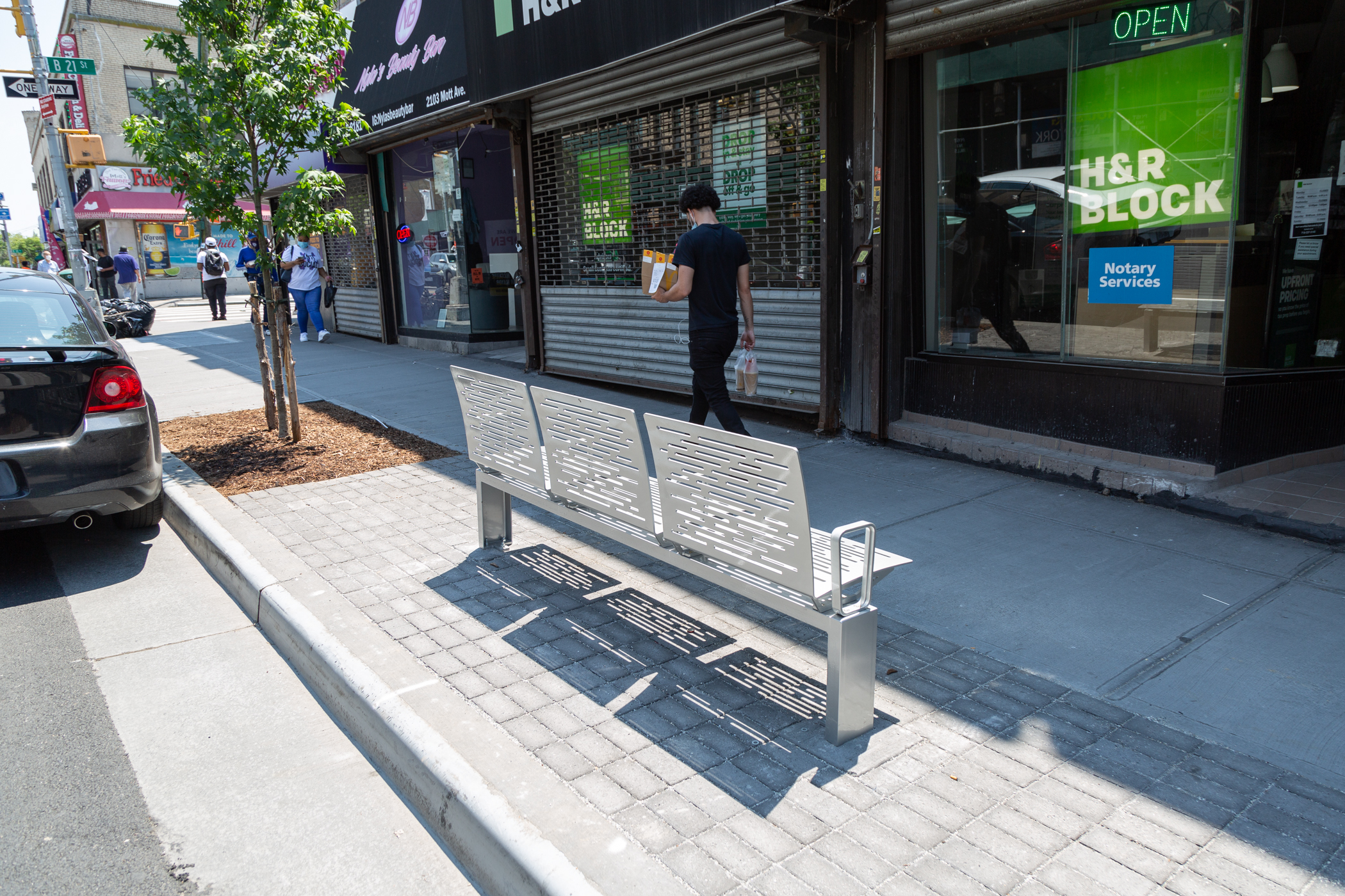 New trees and benches on sidewalks