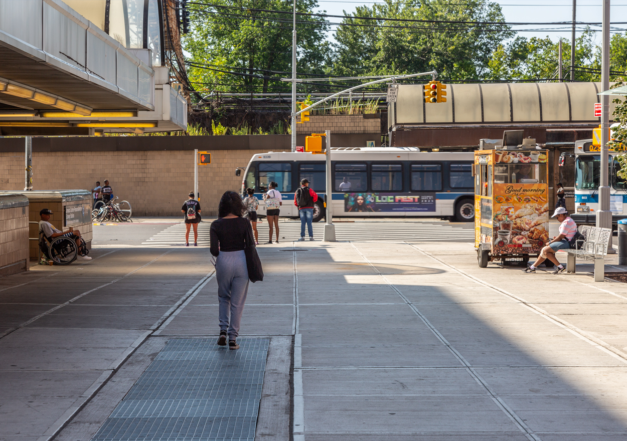 people walking along new expanded pedestrian space