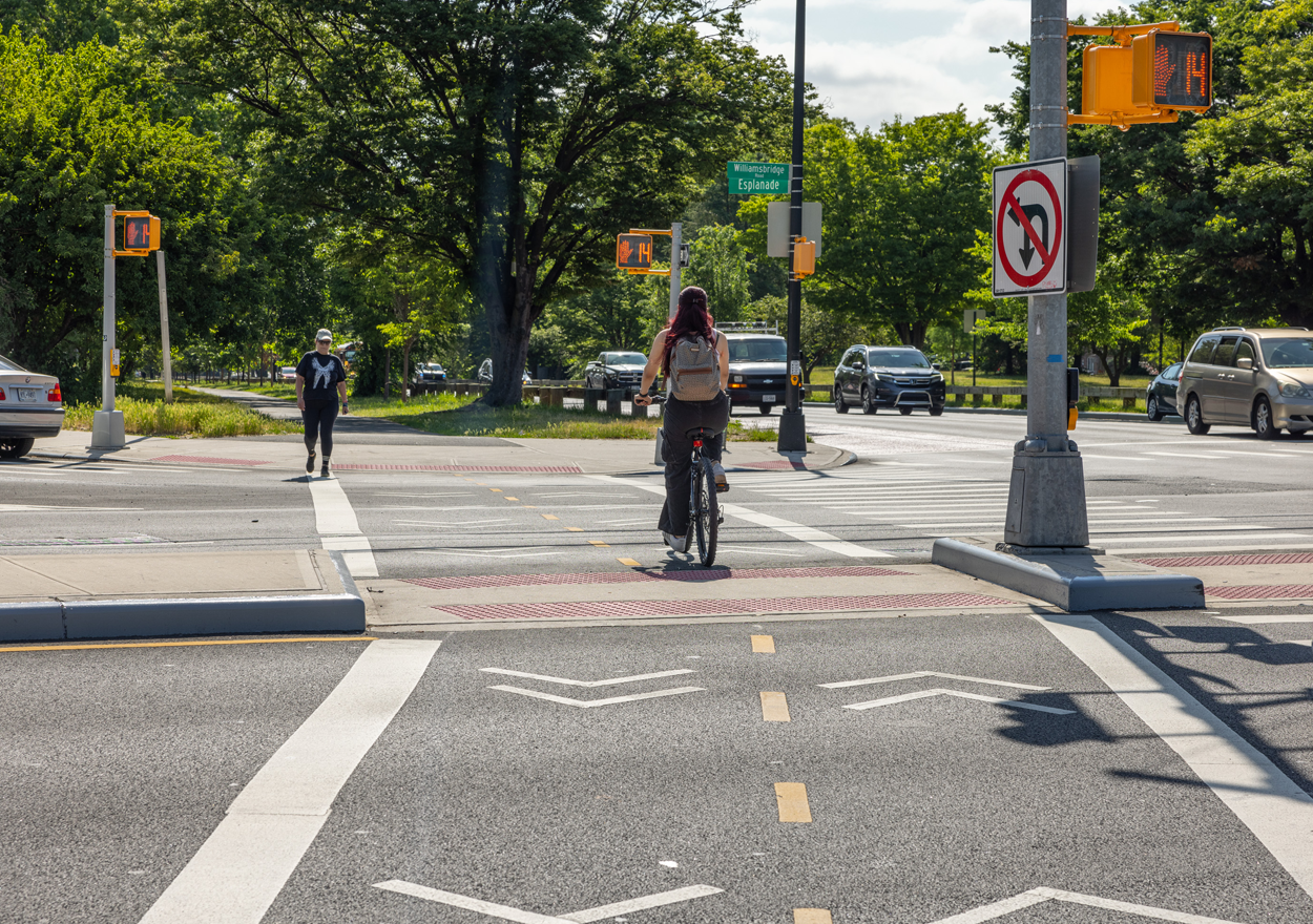 a cyclist rides along designated bike path