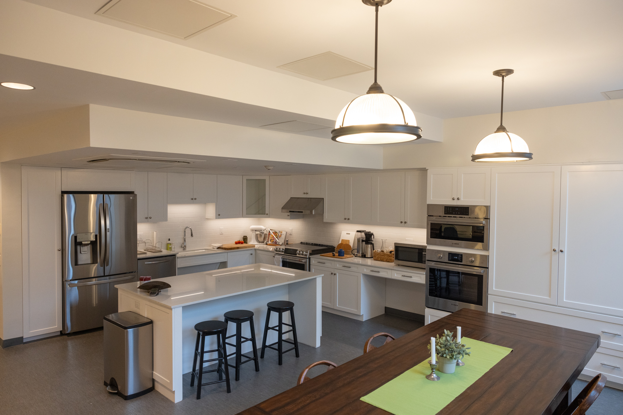 kitchen area with cabinets and furniture