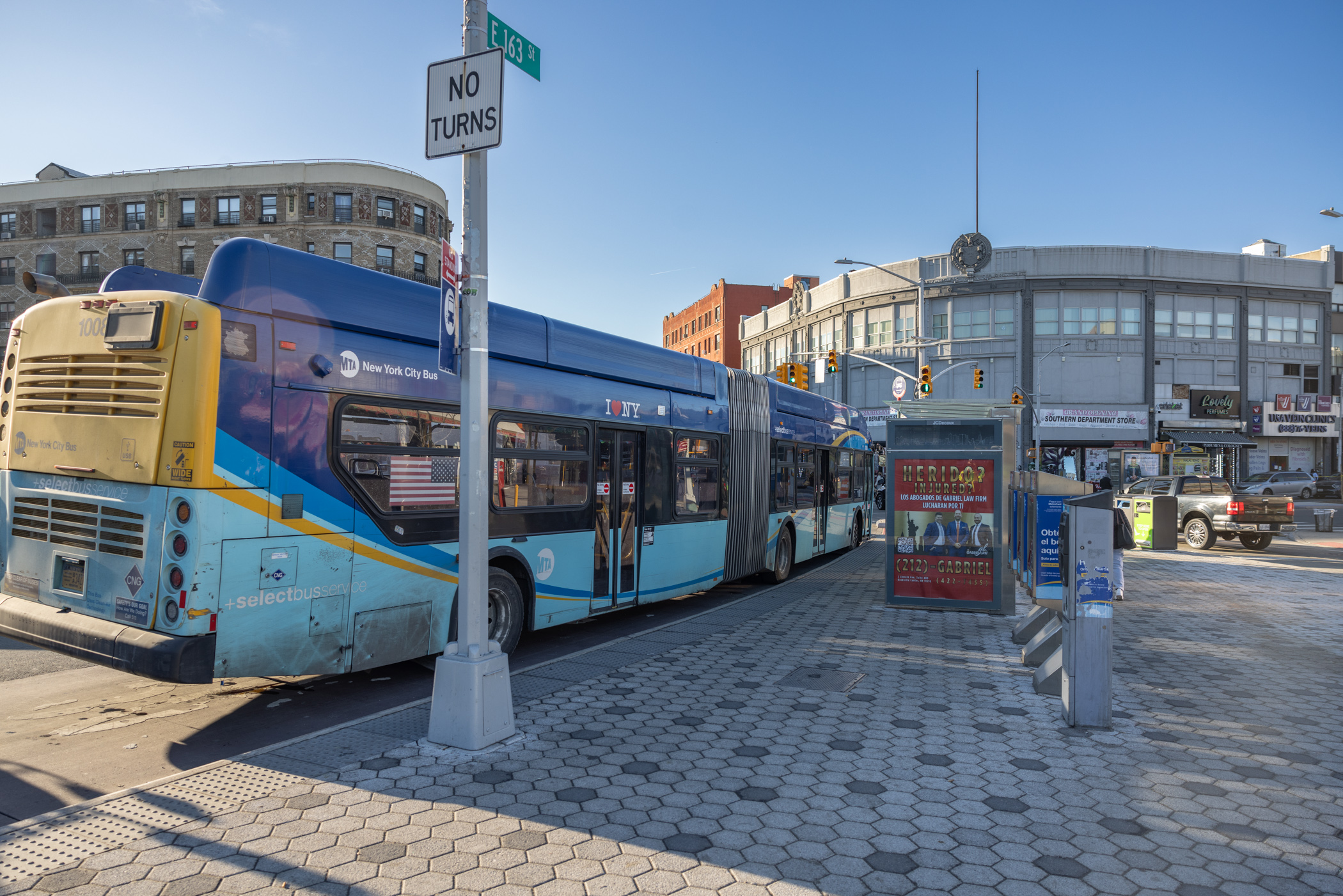 bus stops next to plaza