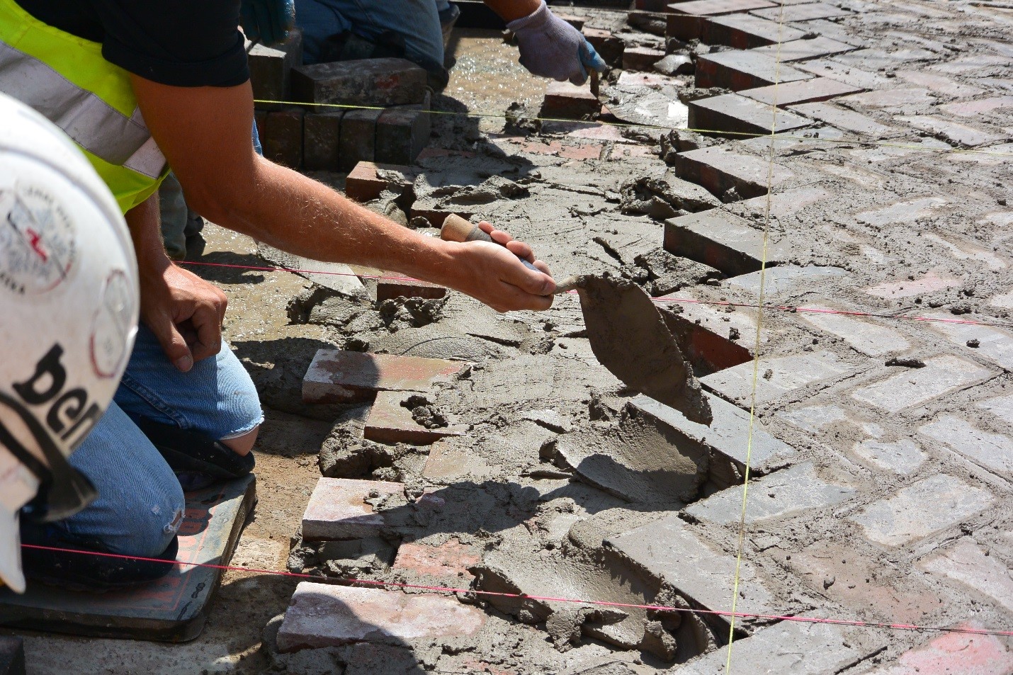 Red brick being laid