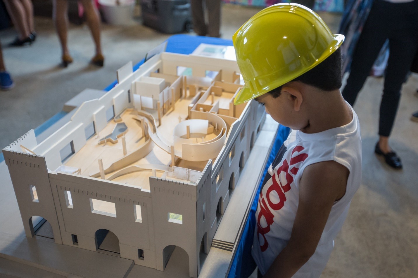 A kid at the groundbreaking ceremony