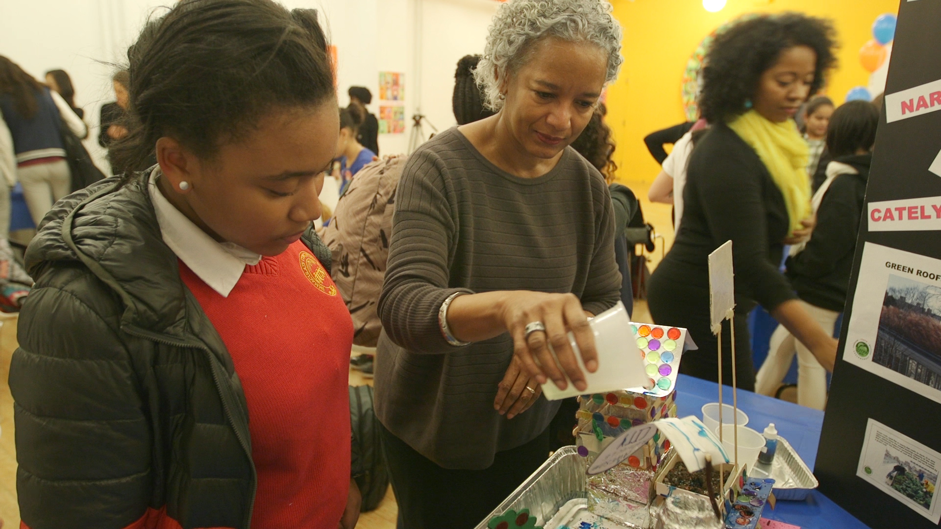 DYCD Deputy Director Candace Reyes-Dandrea with student