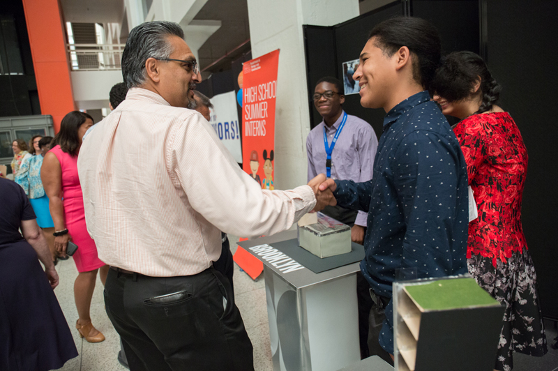 High school interns thank and network with their supervisors.