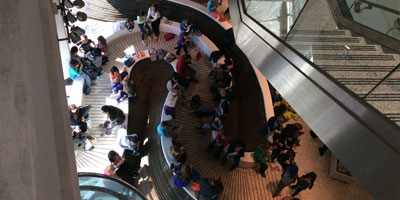 Overhead view of children walking up the stairs of the Visitor Center at Newtown Creek