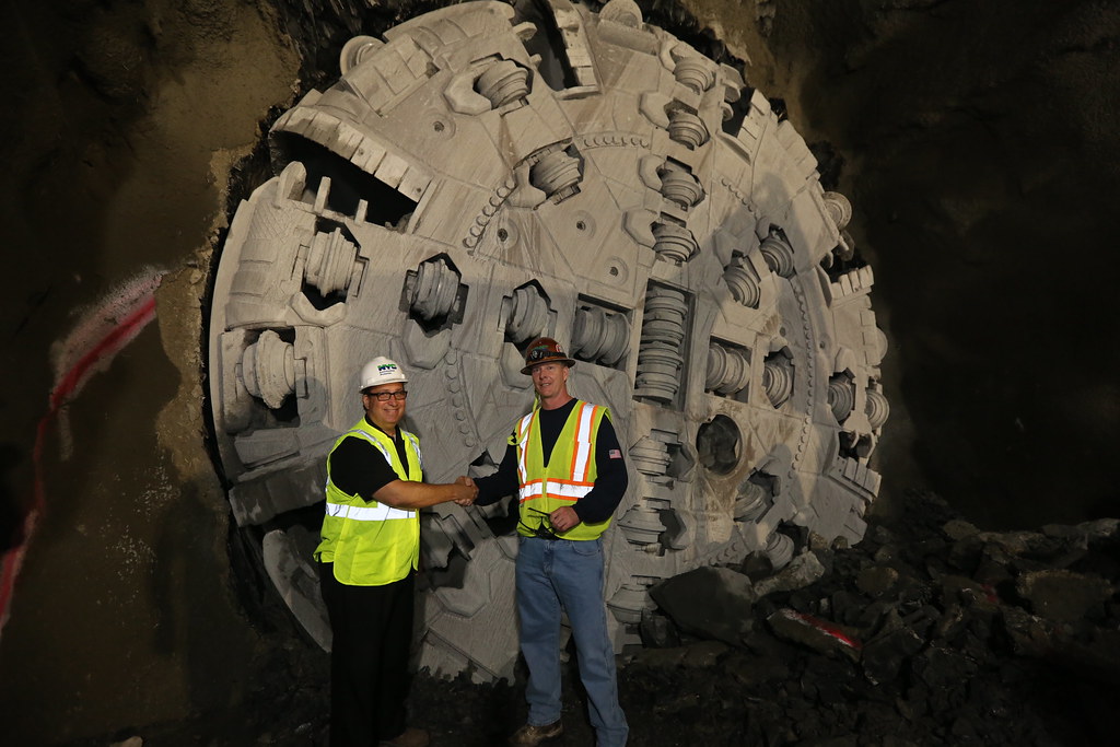 Commissioner Sapienza and Foreman Standing in Front of Tunnel Boring Machine