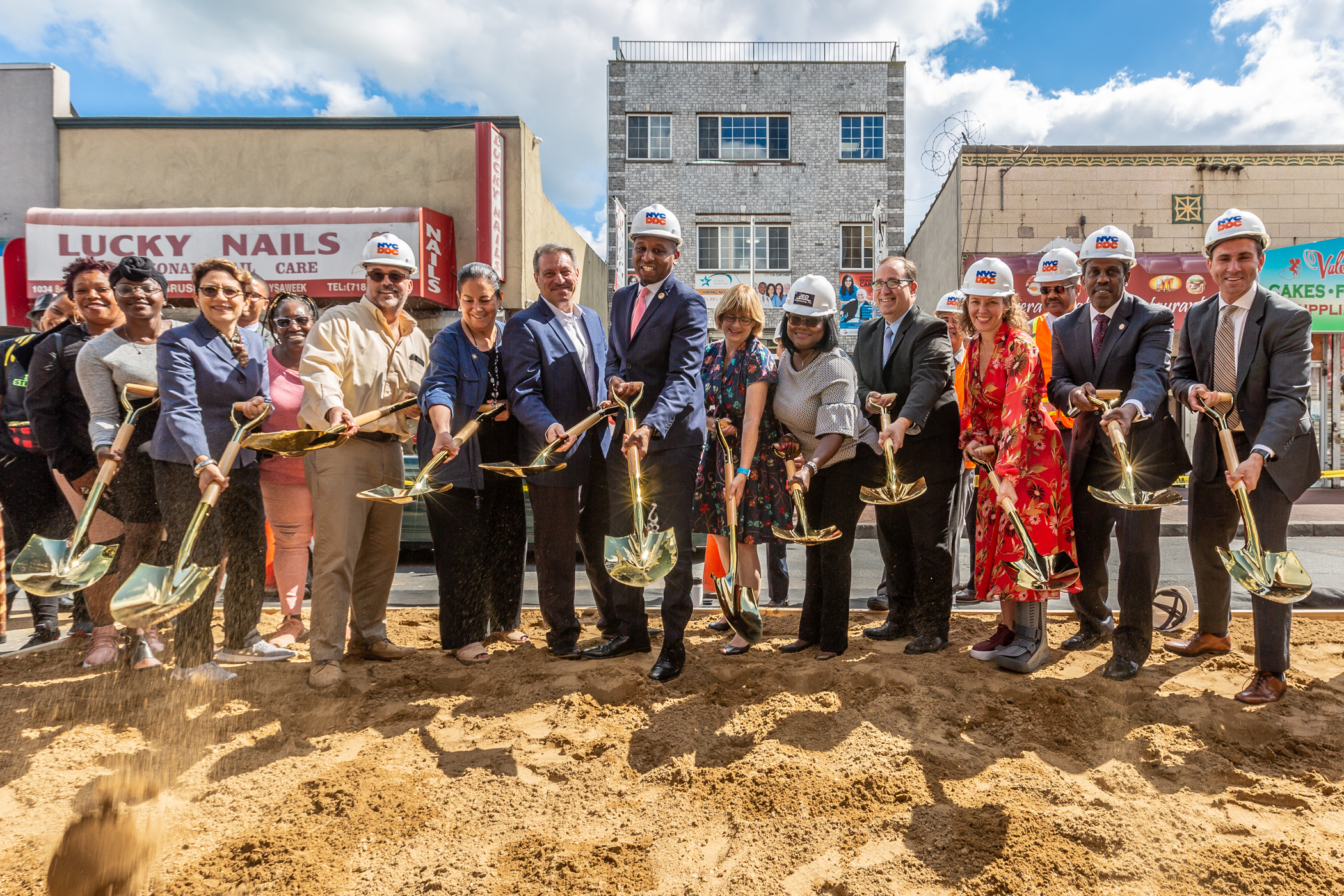 City officials and electeds stand with shovels for groundbreaking